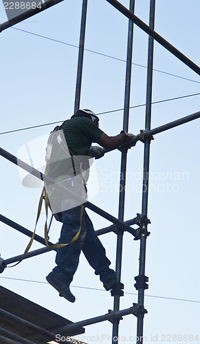 Image of construction worker on scaffold