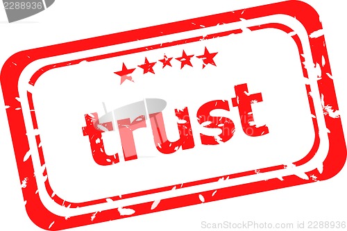Image of trust red rubber stamp over a white background