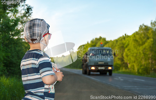 Image of car and boy