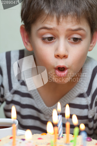 Image of Cute boy at birthday cake