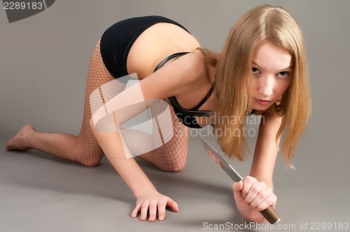 Image of Attractive girl with knife