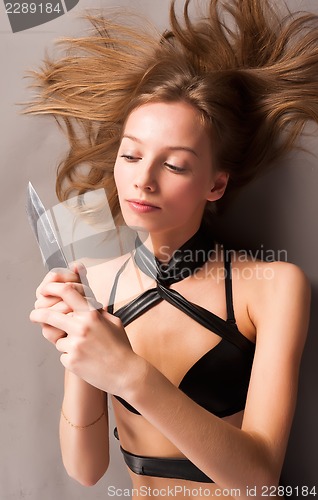 Image of Attractive girl with knife