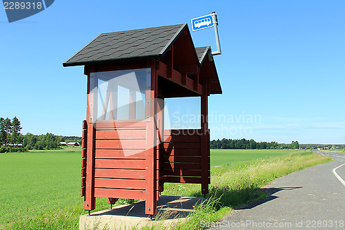 Image of Wooden Bus Stop Shelter by Highway