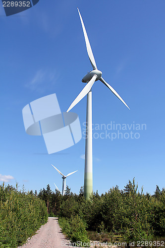 Image of Wind Turbines against Blue Sky at Summer