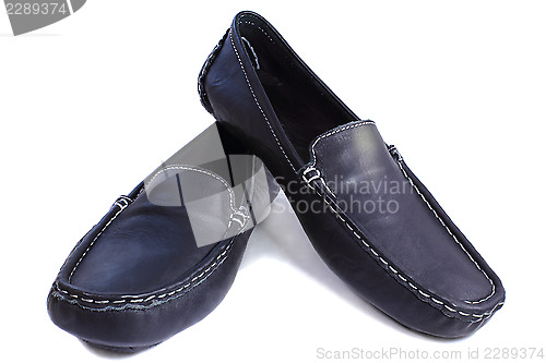 Image of Black leather loafers on a white background.