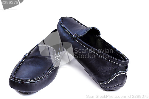 Image of Black leather loafers on a white background.