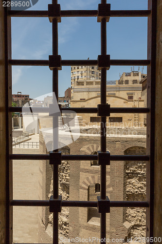 Image of View of an old church through a window