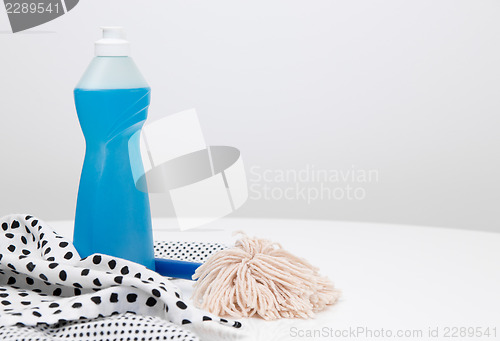 Image of Dishwashing liquid, dishtowels and brush