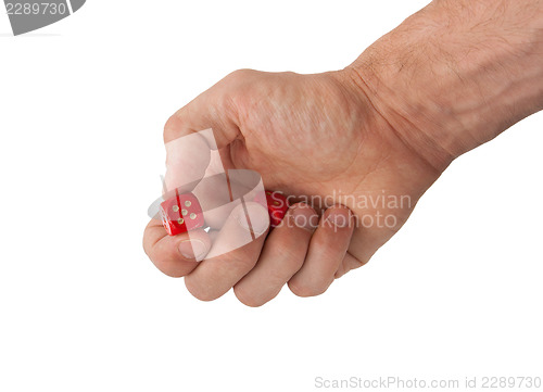 Image of Hand holding red dices