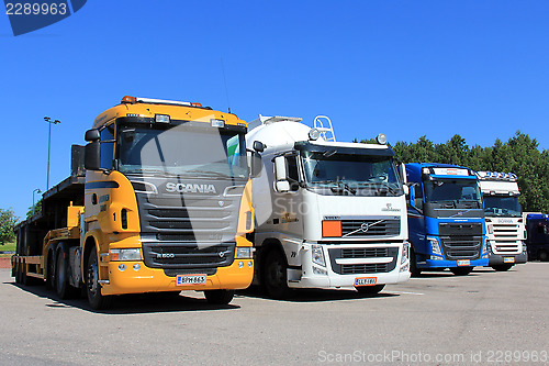Image of Row of Trucks Parked