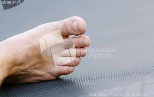 Image of male legs on green grass