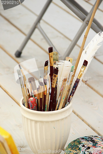 Image of Vivid paintbrushes at the atelier 