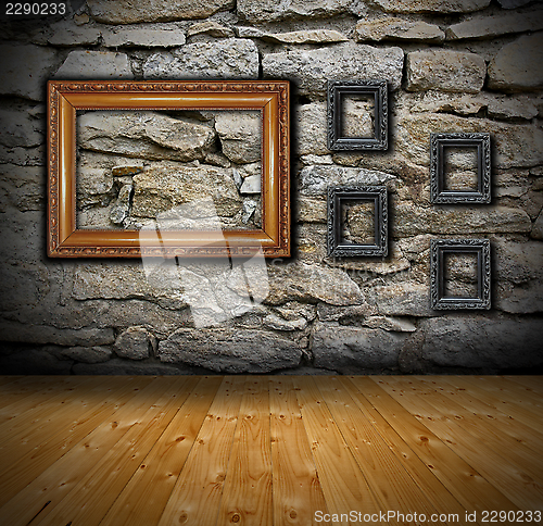 Image of interior with old frames on wall