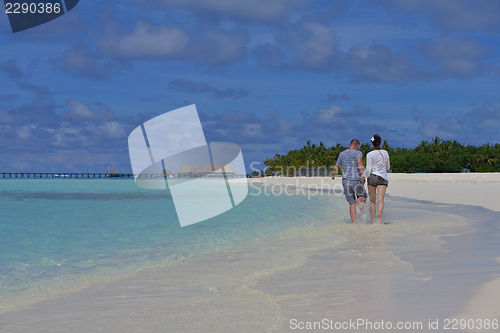 Image of happy young  couple at summer vacation have fun and relax at bea