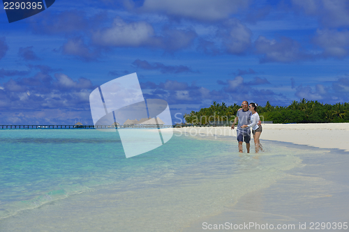 Image of happy young  couple at summer vacation have fun and relax at bea