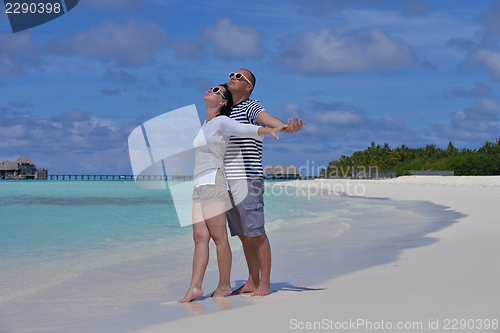 Image of happy young  couple at summer vacation have fun and relax at bea