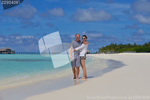 Image of happy young  couple at summer vacation have fun and relax at bea