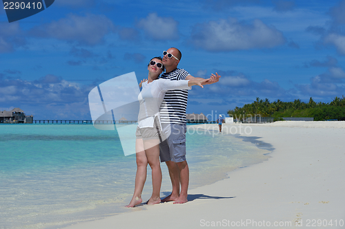 Image of happy young  couple at summer vacation have fun and relax at bea