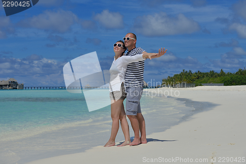 Image of happy young  couple at summer vacation have fun and relax at bea