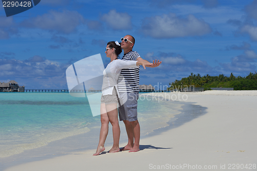 Image of happy young  couple at summer vacation have fun and relax at bea
