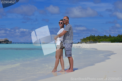 Image of happy young  couple at summer vacation have fun and relax at bea