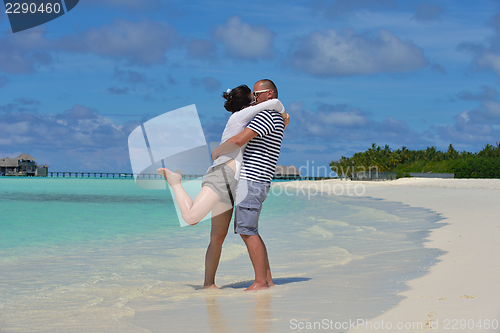 Image of happy young  couple at summer vacation have fun and relax at bea