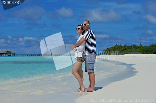 Image of happy young  couple at summer vacation have fun and relax at bea