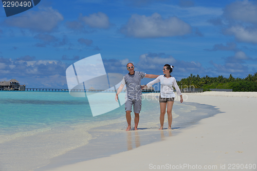 Image of happy young  couple at summer vacation have fun and relax at bea