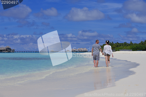 Image of happy young  couple at summer vacation have fun and relax at bea