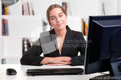 Image of Businesswoman At Office Desk