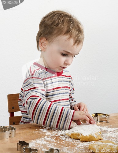 Image of young child making cookies