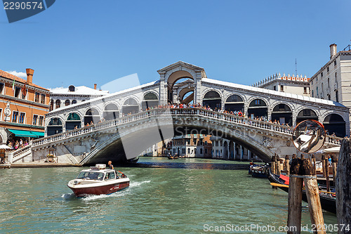 Image of ITALY, VENICE - JULY 2012 - A lot of traffic on the Grand Canal under Ponte di Rialto on July 16, 2012 in Venice. More than 20 m