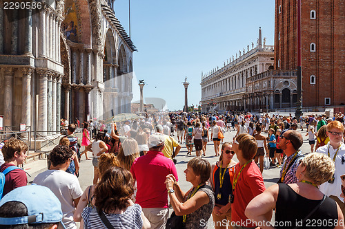 Image of ITALY, VENICE - JULY 2012: St Marco Square with crowd of tourist on July 16, 2012 in Venice. St Marco Square is the largest and most famous square in Venice.