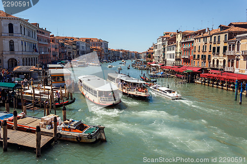 Image of ITALY, VENICE - JULY 2012 - A lot of traffic on the Grand Canal on July 16, 2012 in Venice. More than 20 million tourists come to Venice annually. 