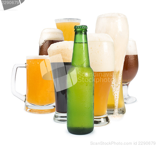 Image of Mug filled with beer and bottles