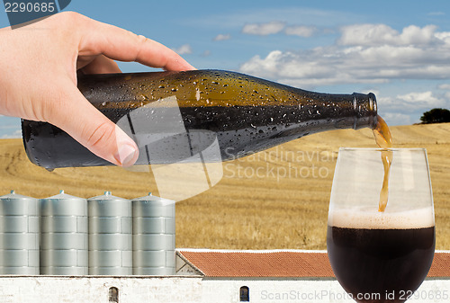 Image of Beer and factory on the background