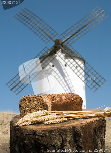Image of Different breads and windmill in the background