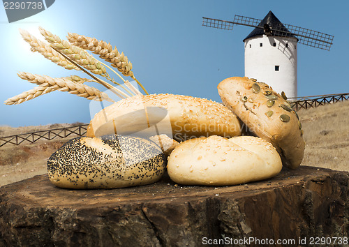 Image of Different breads and windmill in the background