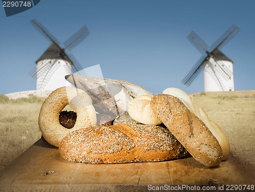 Image of Different breads and windmill in the background