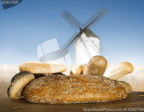 Image of Different breads and windmill in the background