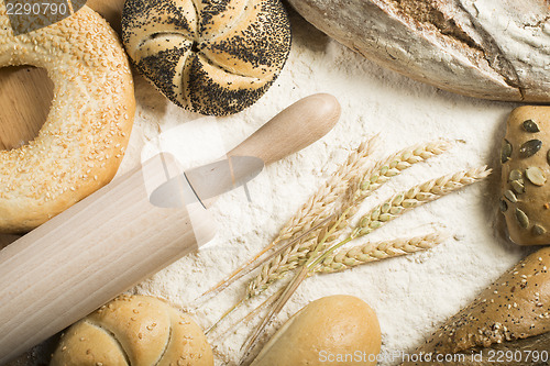 Image of Breads. Pile of flour, rolling pin and wheat