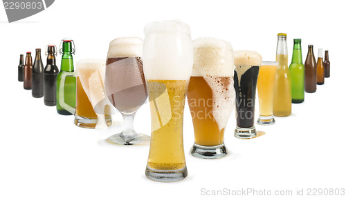 Image of Mug filled with beer and bottles