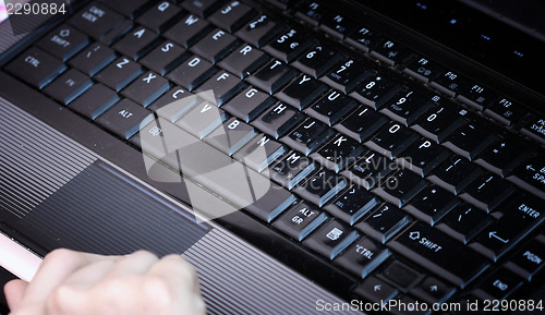Image of Working at laptop .