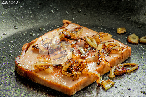 Image of baked meat loaf with onions