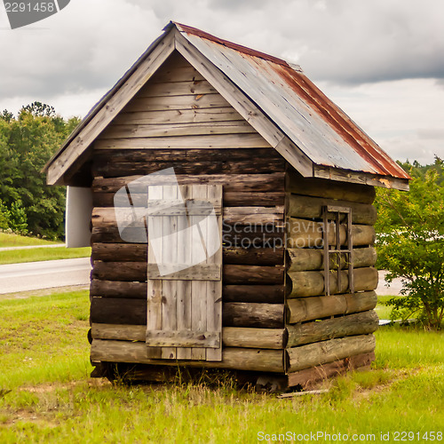 Image of old wood log cabin in forest