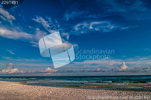 Image of sand, sky and water beach scene