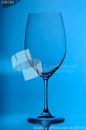 Image of wineglass on blue