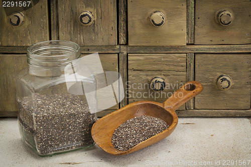 Image of jar and scoop of chia seeds