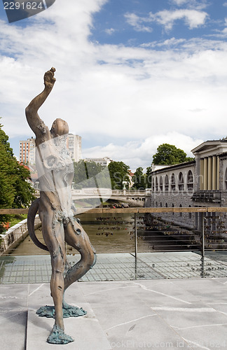 Image of statue of Prometheus on Butcher's Bridge with padlocks Ljubljani