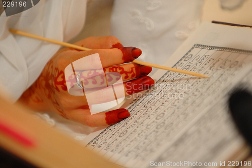 Image of Bride reading Quran